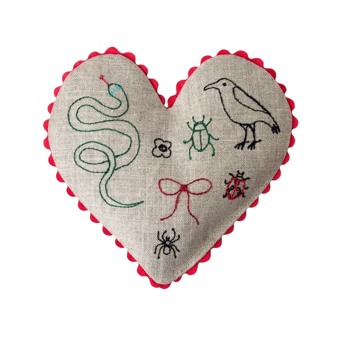 Linen heart sachet with red scalloped edge and stitched snake, bugs, and bird