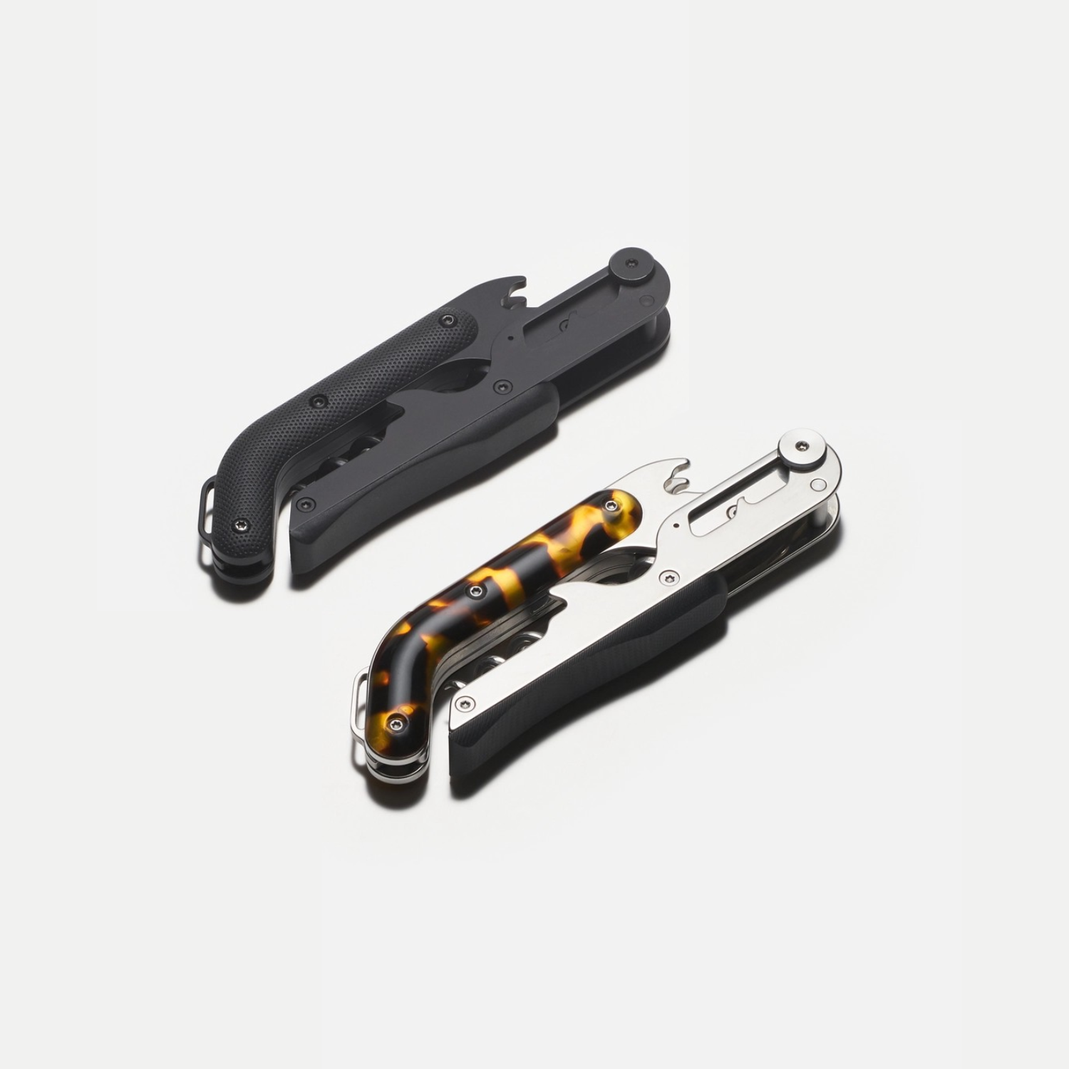Black and amber tortoise wine corkscrew with folding handle and bottle opener