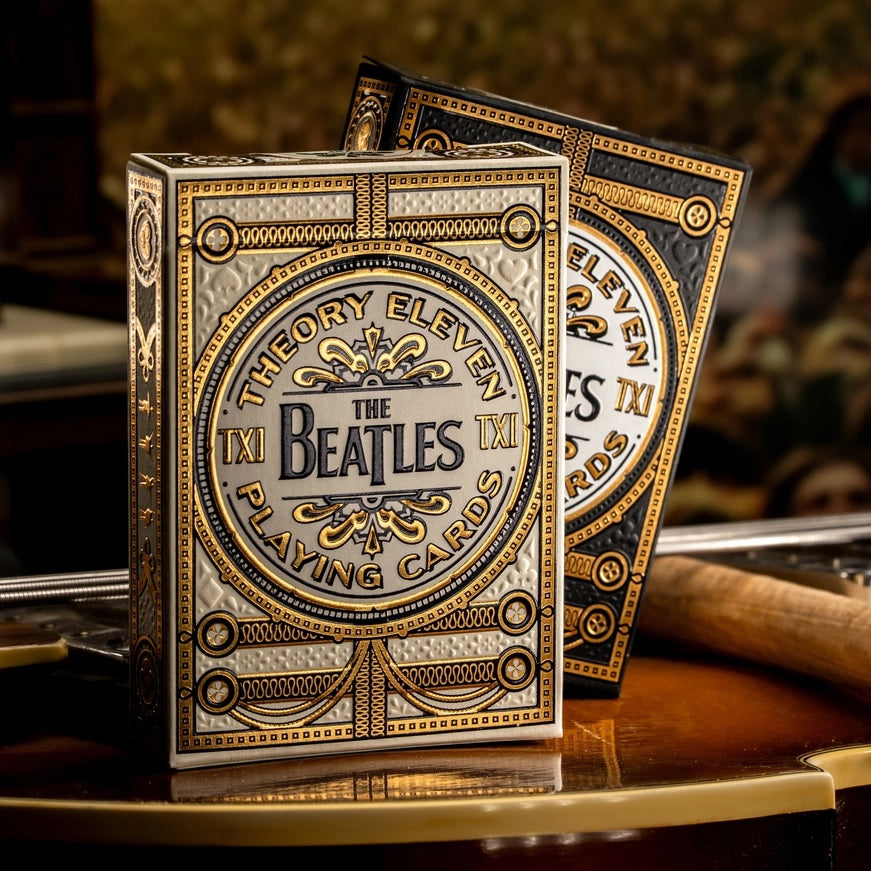 Ornate Beatles playing card deck with gold text on white backs