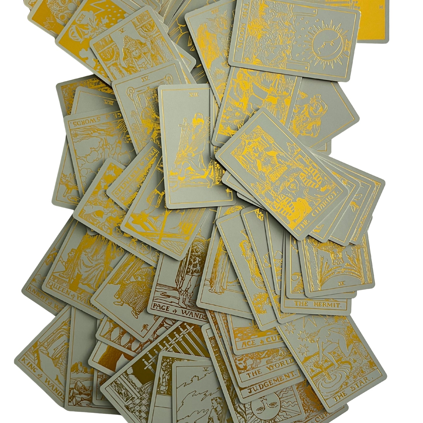 Gold-foil tarot cards scattered in a pile, showing ornate figures and titles