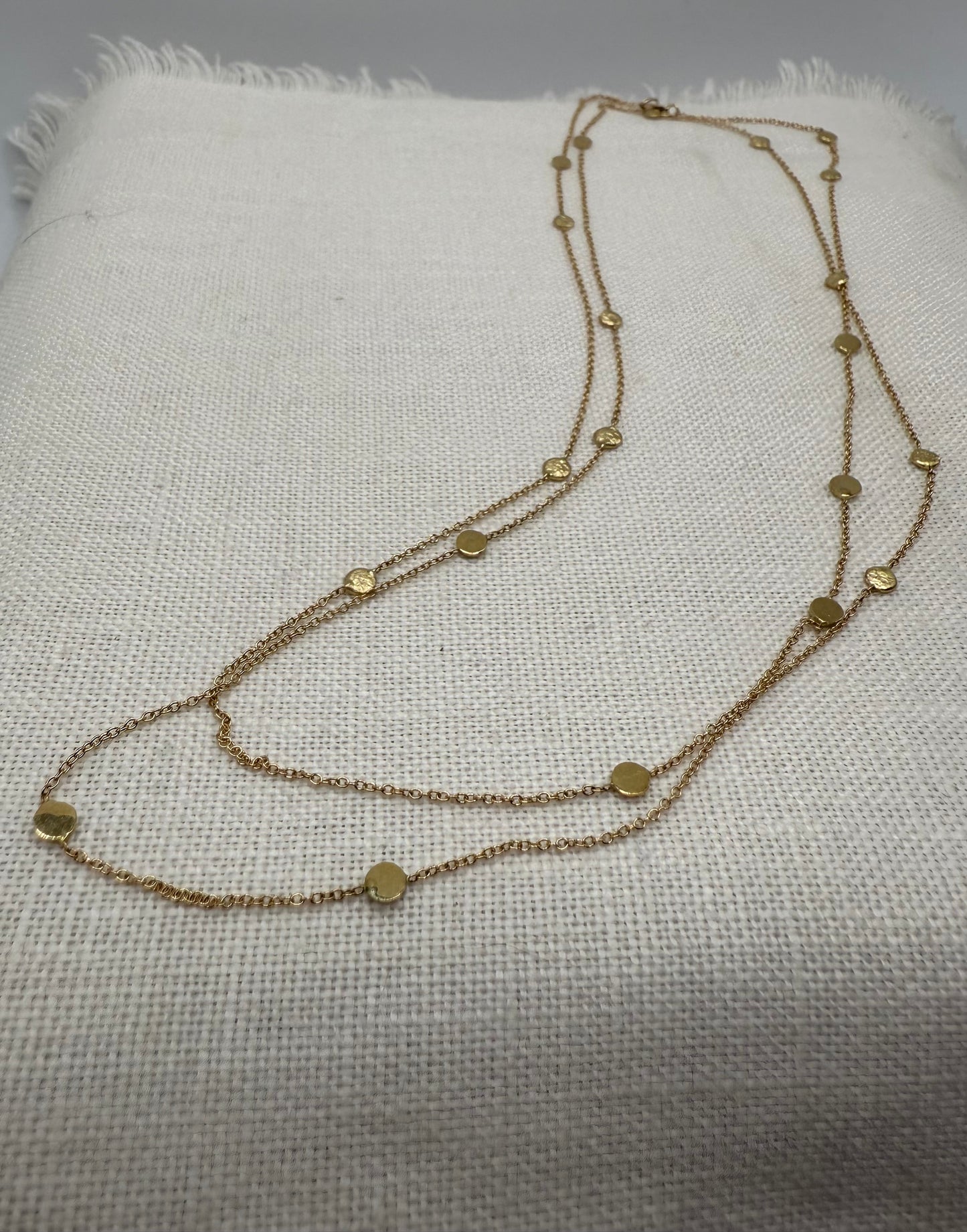 14k gold polka dot necklace with round bead and disc stations, layered look