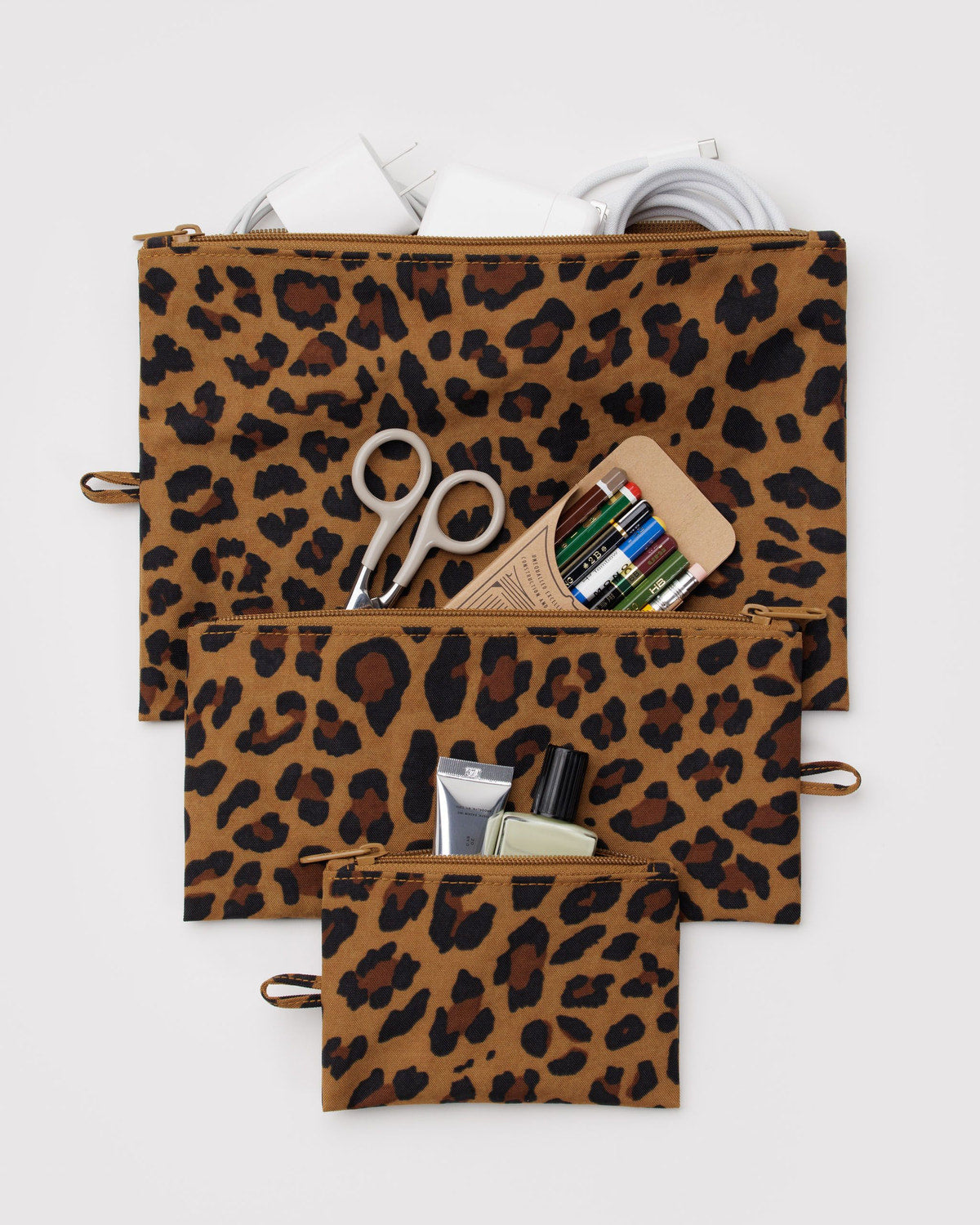 Set of three flat zipper pouches with leopard print in brown and black