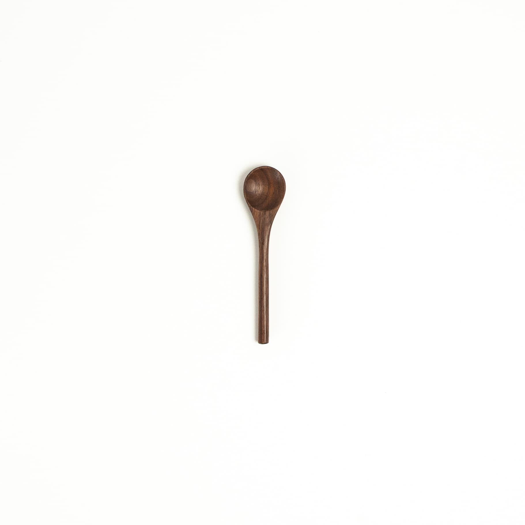 Walnut wood tiny serving spoon with rounded bowl and narrow handle