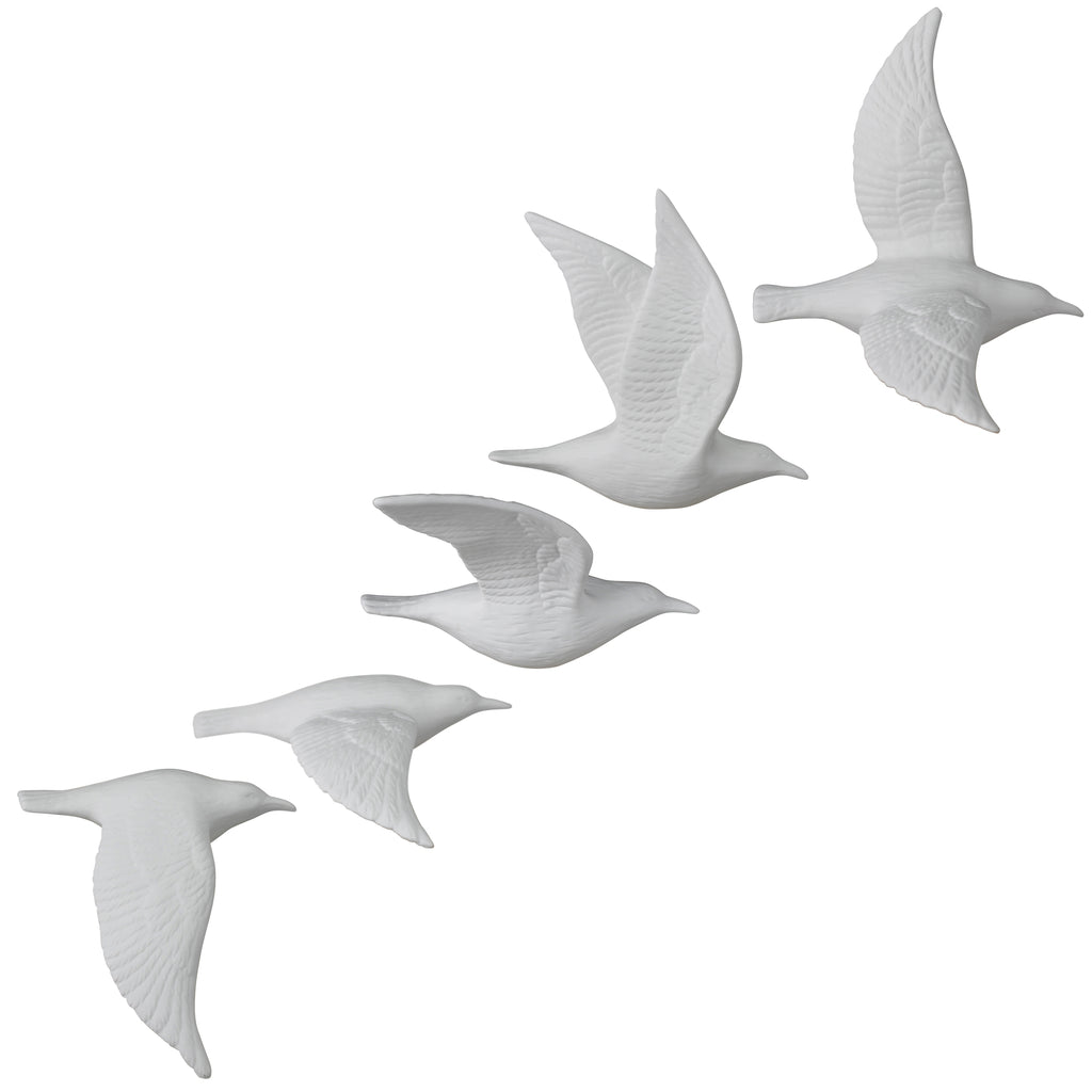 Set of five white bone china flying gull figurines with raised wing details