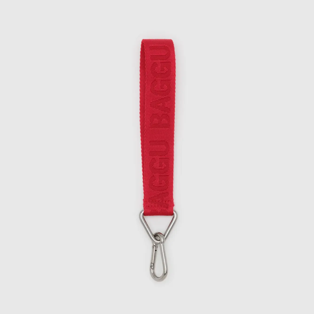Red BAGGU logo keychain with embossed text and silver metal clasp