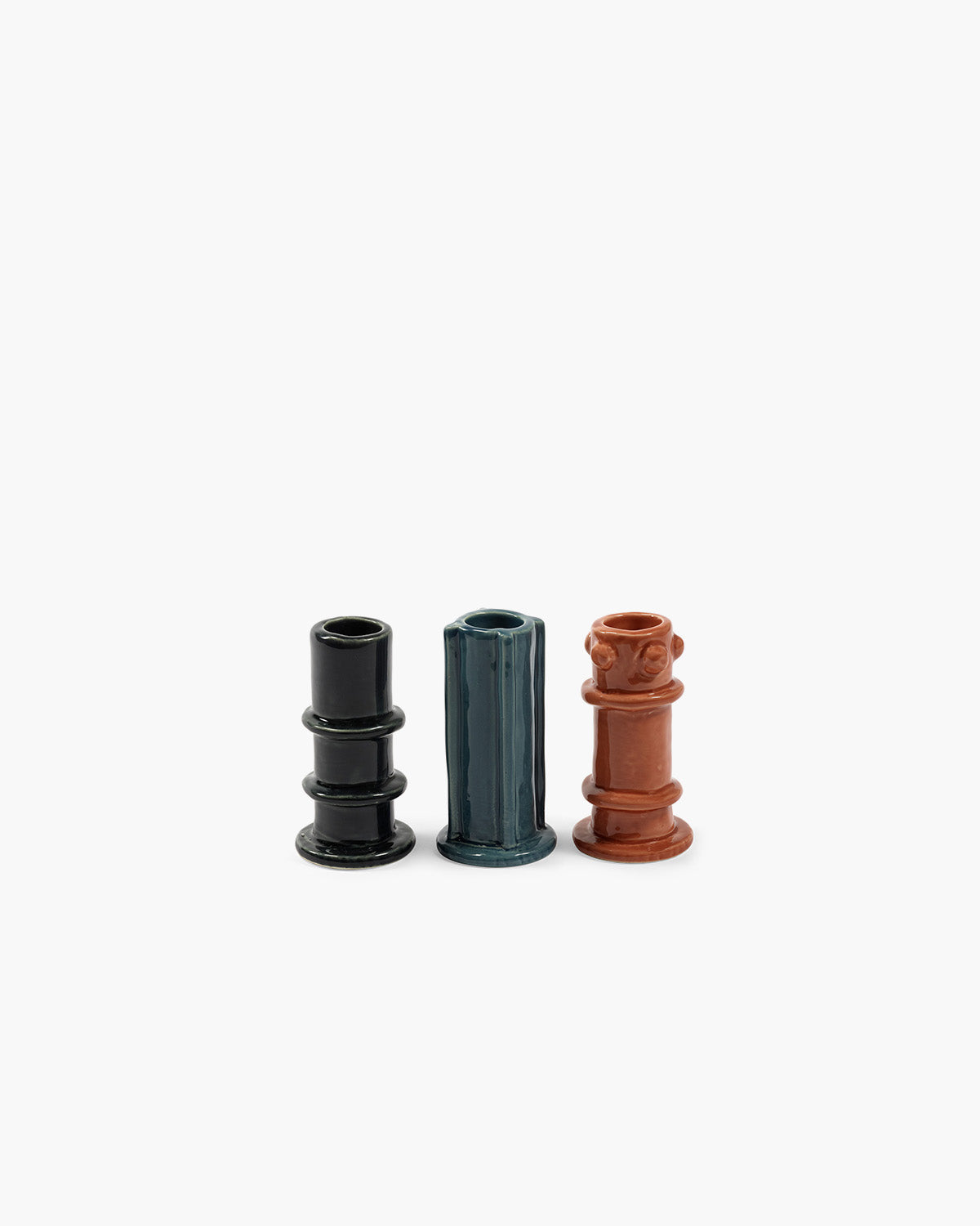 Glazed tall candle holders in navy rings, teal ribs, terracotta knobs—set of 3