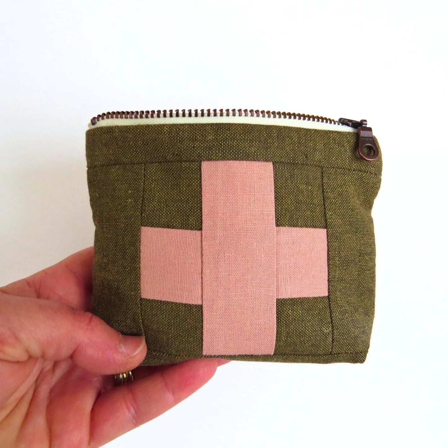 Mini first aid kit pouch in olive fabric with pale pink patchwork cross and top zipper