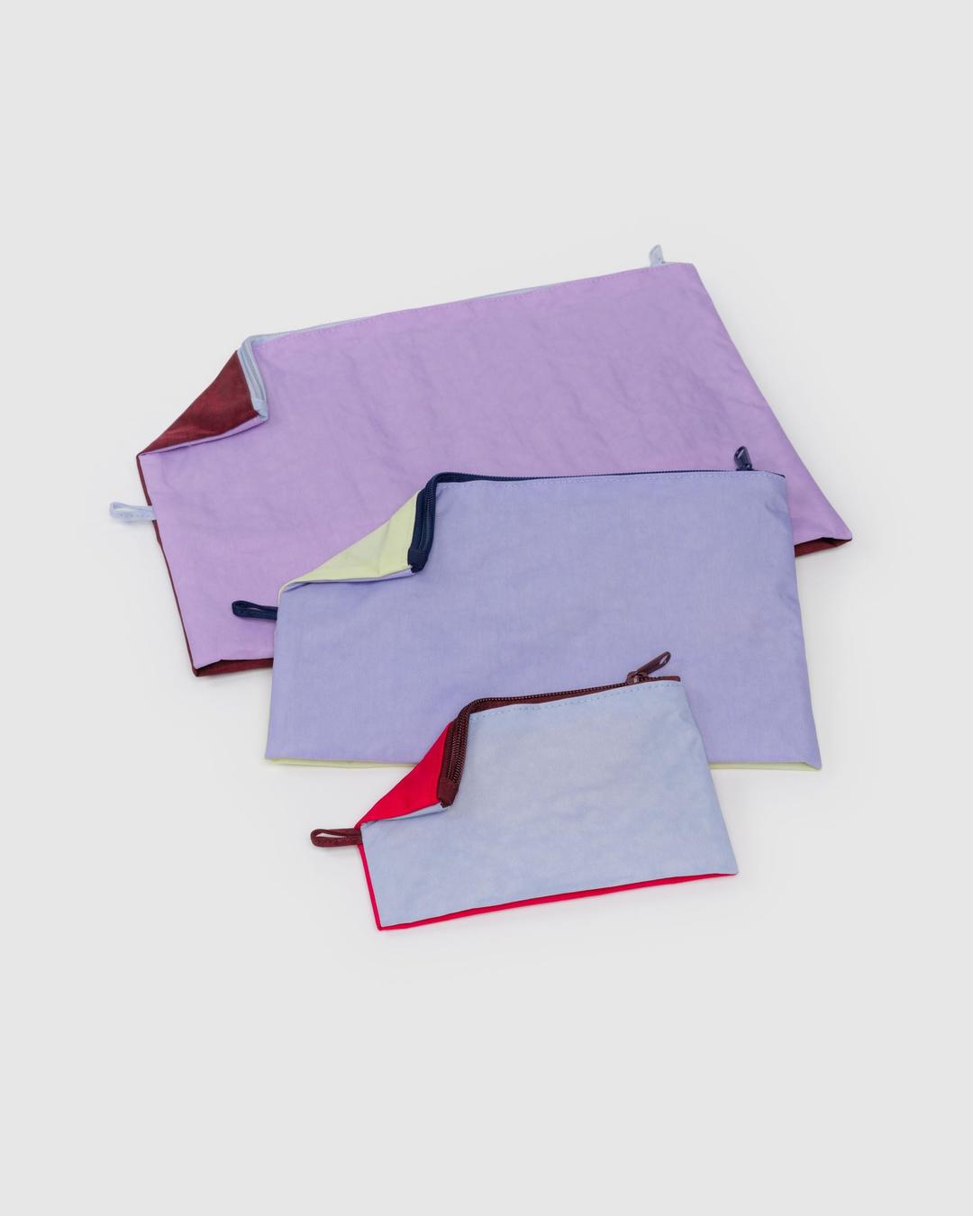 Go pouch set of three solid-color fabric zip pouches in lavender and red accents
