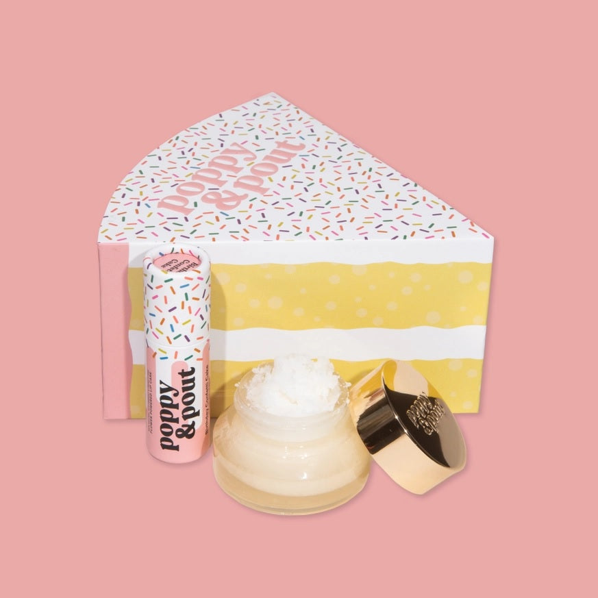 Lip care duo set in open box with lip balm tube, white cream jar, and cap