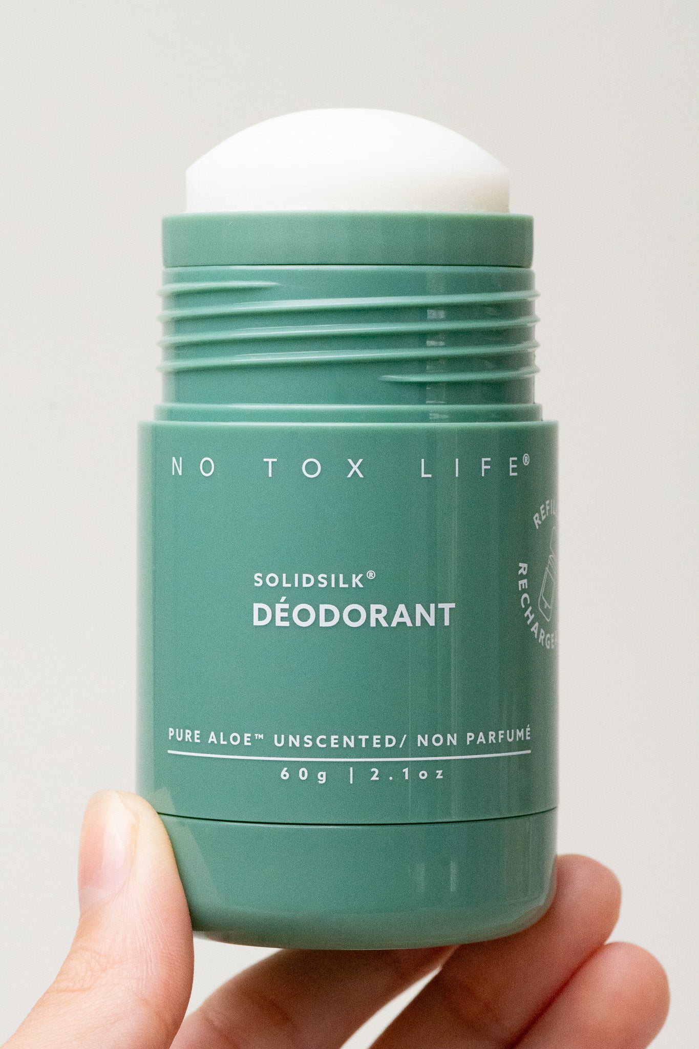 Refillable Solidsilk™ deodorant stick, teal green with Pure Aloe Unscented label