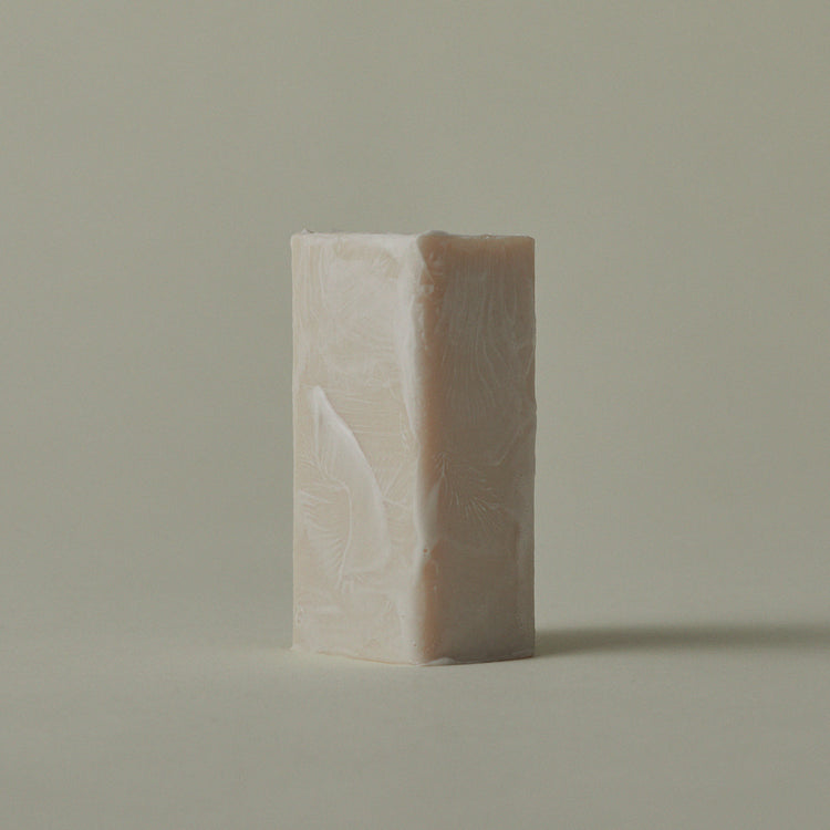 Mini soap bar with embossed leaf pattern, light front and darker back