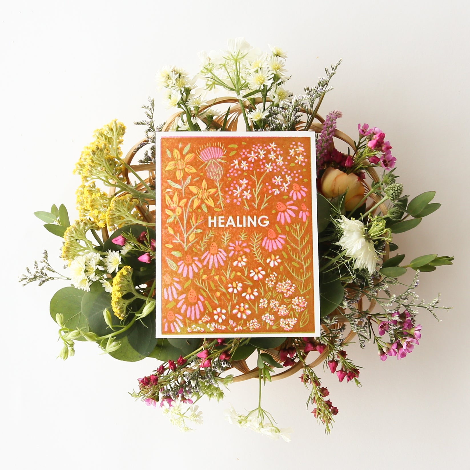 Sympathy card with orange botanical pattern, flowers, and 'HEALING' text