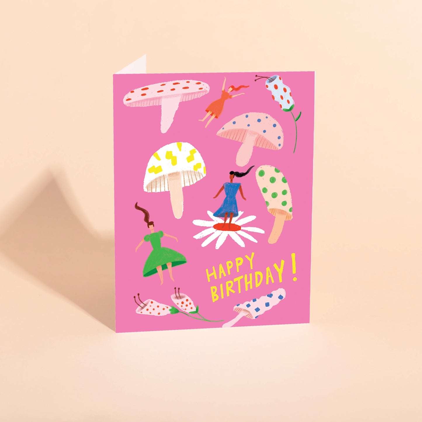 Birthday card with colorful mushroom illustration and "Happy Birthday!" text