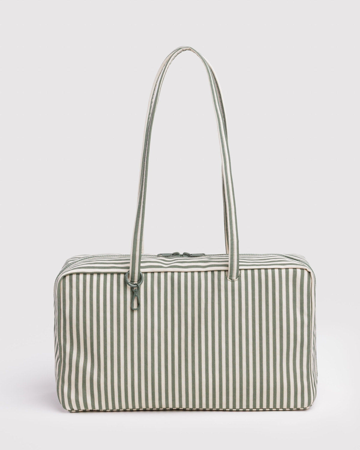 Medium nylon bowler bag in sage striped fabric with long top handles and zip top.