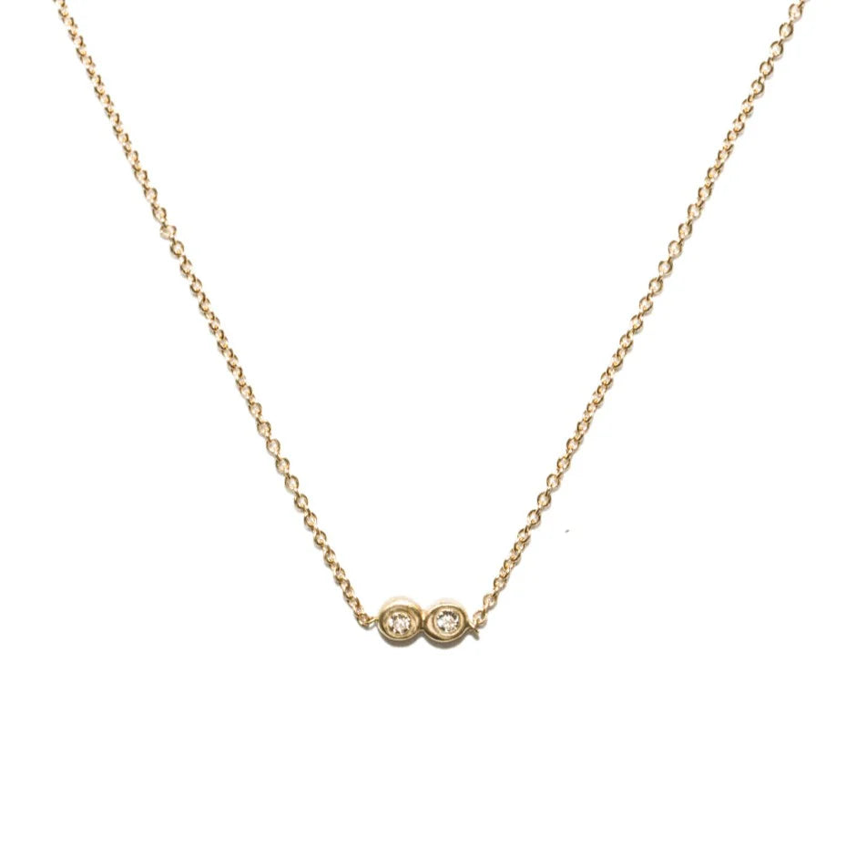 14k gold necklace with double round settings and diamond accents