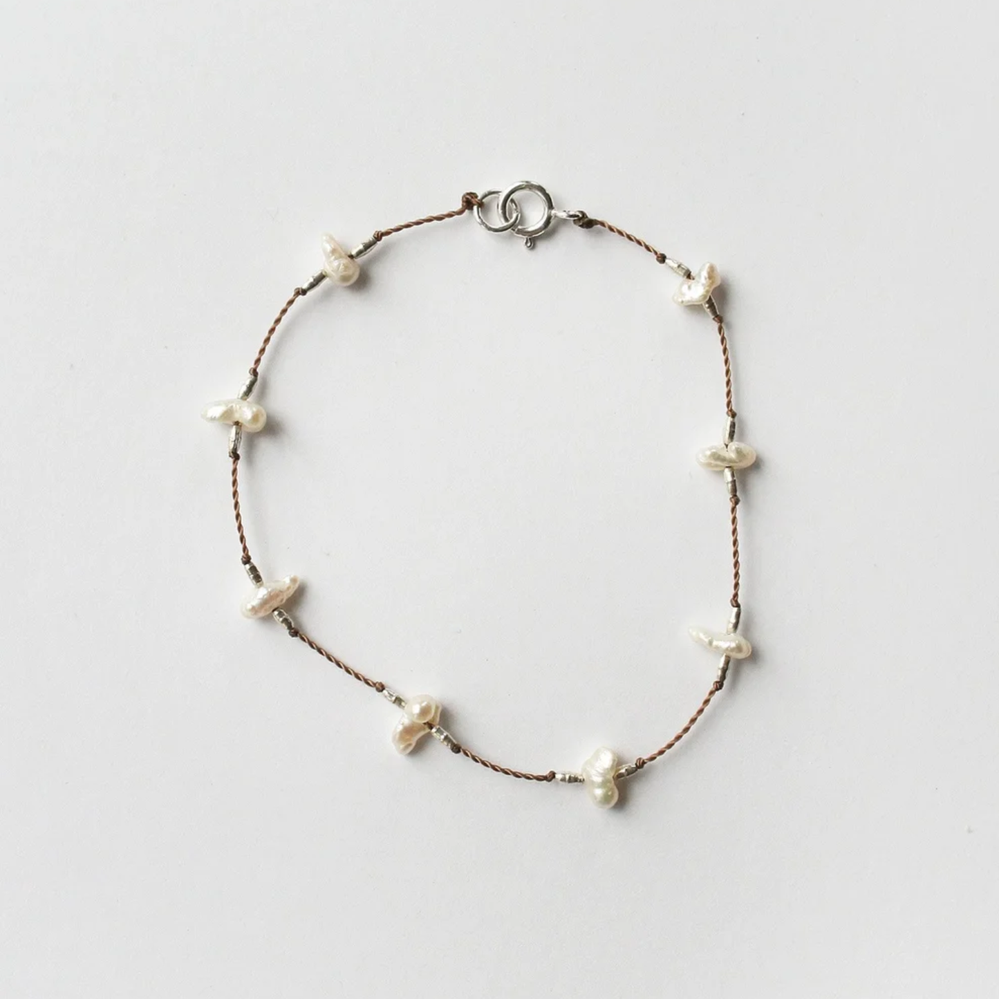 Keshi pearl bracelet with brown beaded chain and white keshi pearls, round clasp