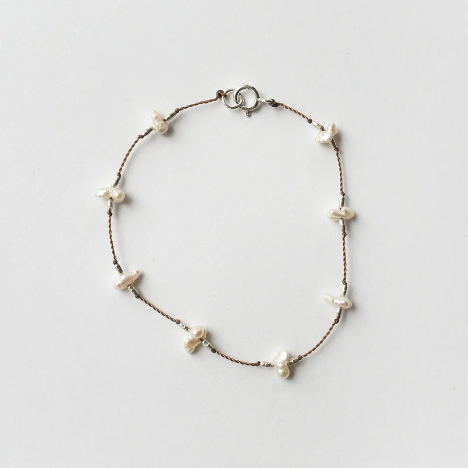 Keshi pearl bracelet with brown beaded chain and white keshi pearls, round clasp