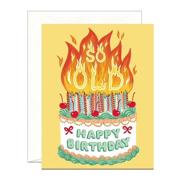 Vintage birthday card with flaming candle cake and “HAPPY BIRTHDAY” text