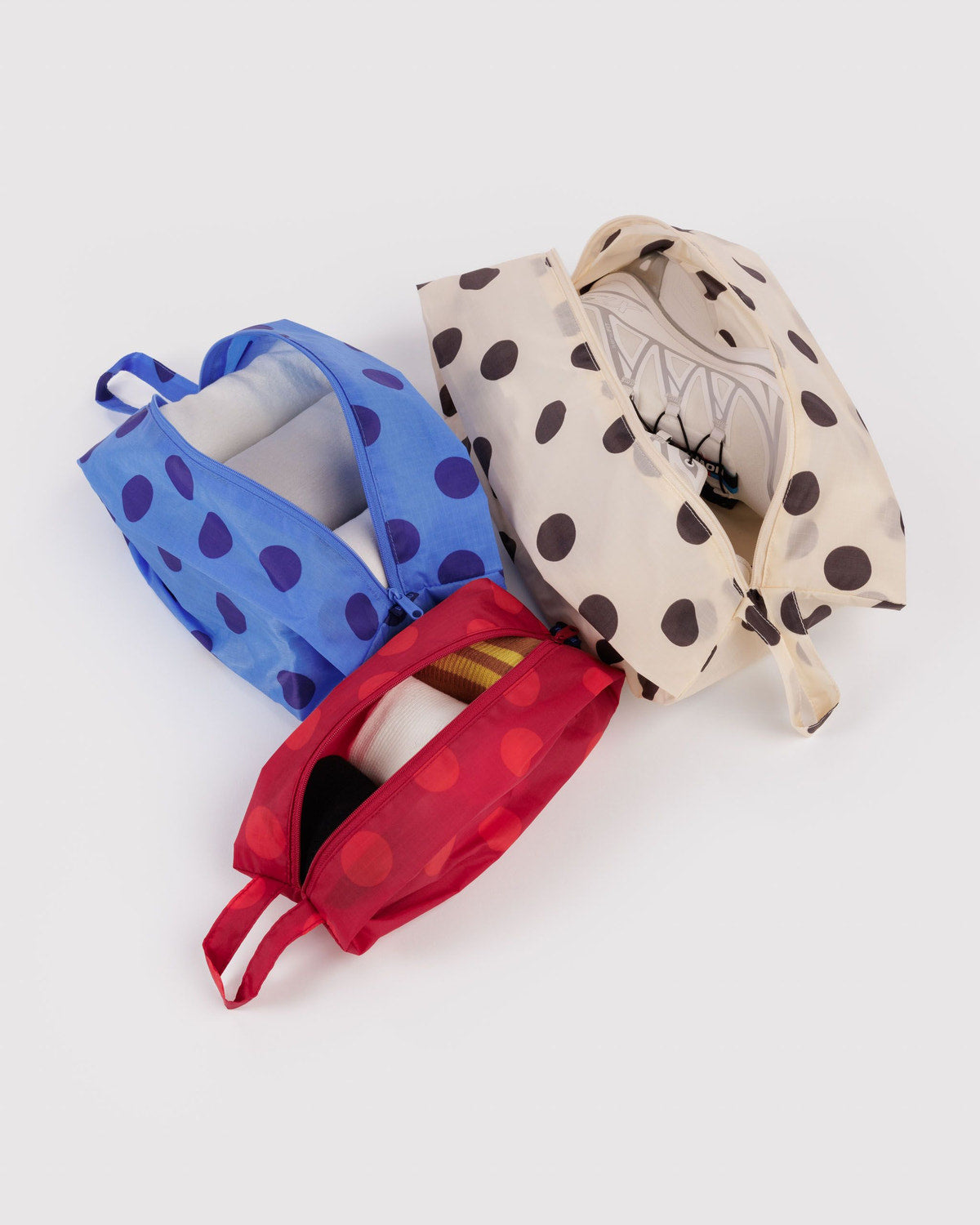 3D zip set with polka-dot prints in blue, cream, and red