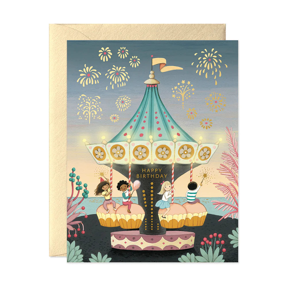Birthday greeting card with colorful carousel, fireworks, and 'Happy Birthday' text