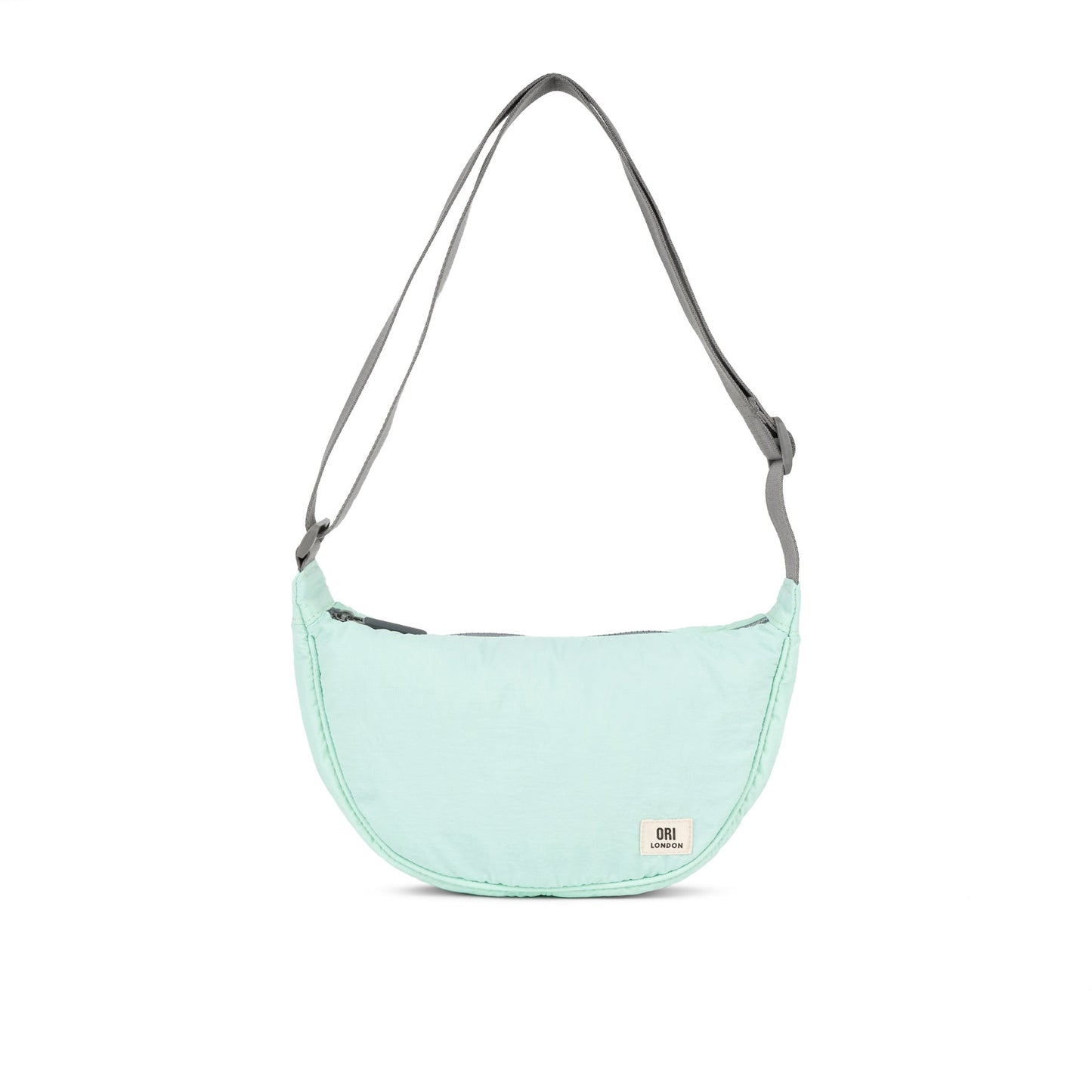 Mint half-moon crossbody bag with gray webbing strap and curved zip top.