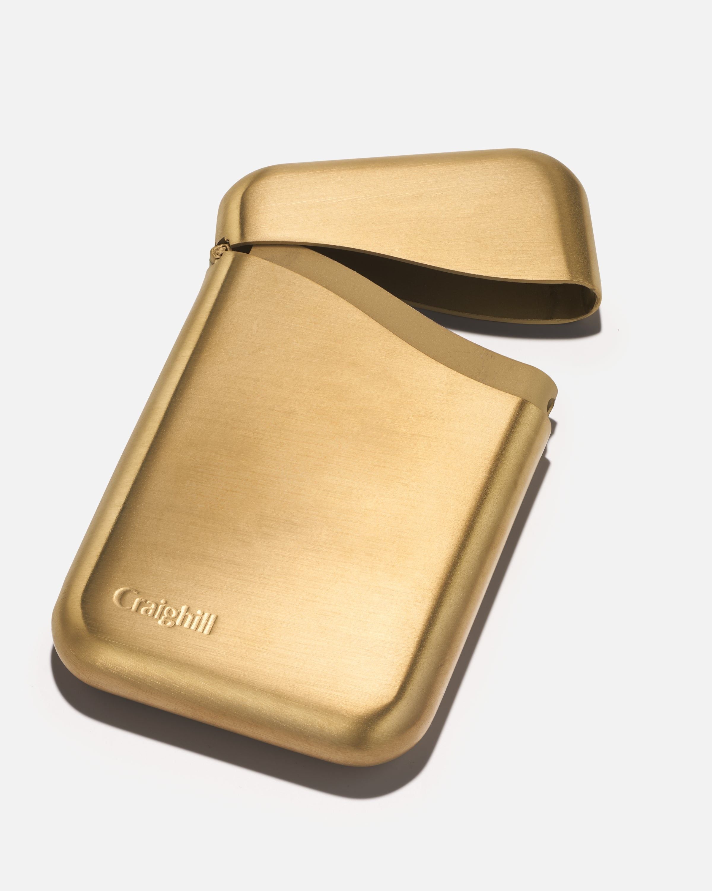 Summit card case in vapor brass with foldover flap and embossed logo