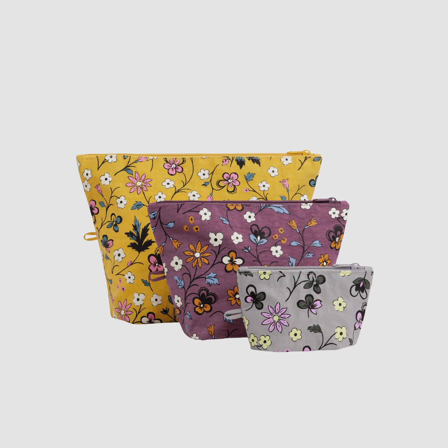 Go pouch set of three fabric zip pouches with floral prints in yellow, purple, and white