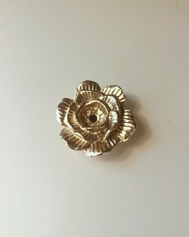 Brass flower-shaped incense holder with round center