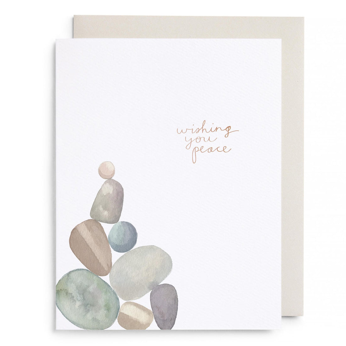 Greeting card with watercolor rocks and script text 'wishing you peace'
