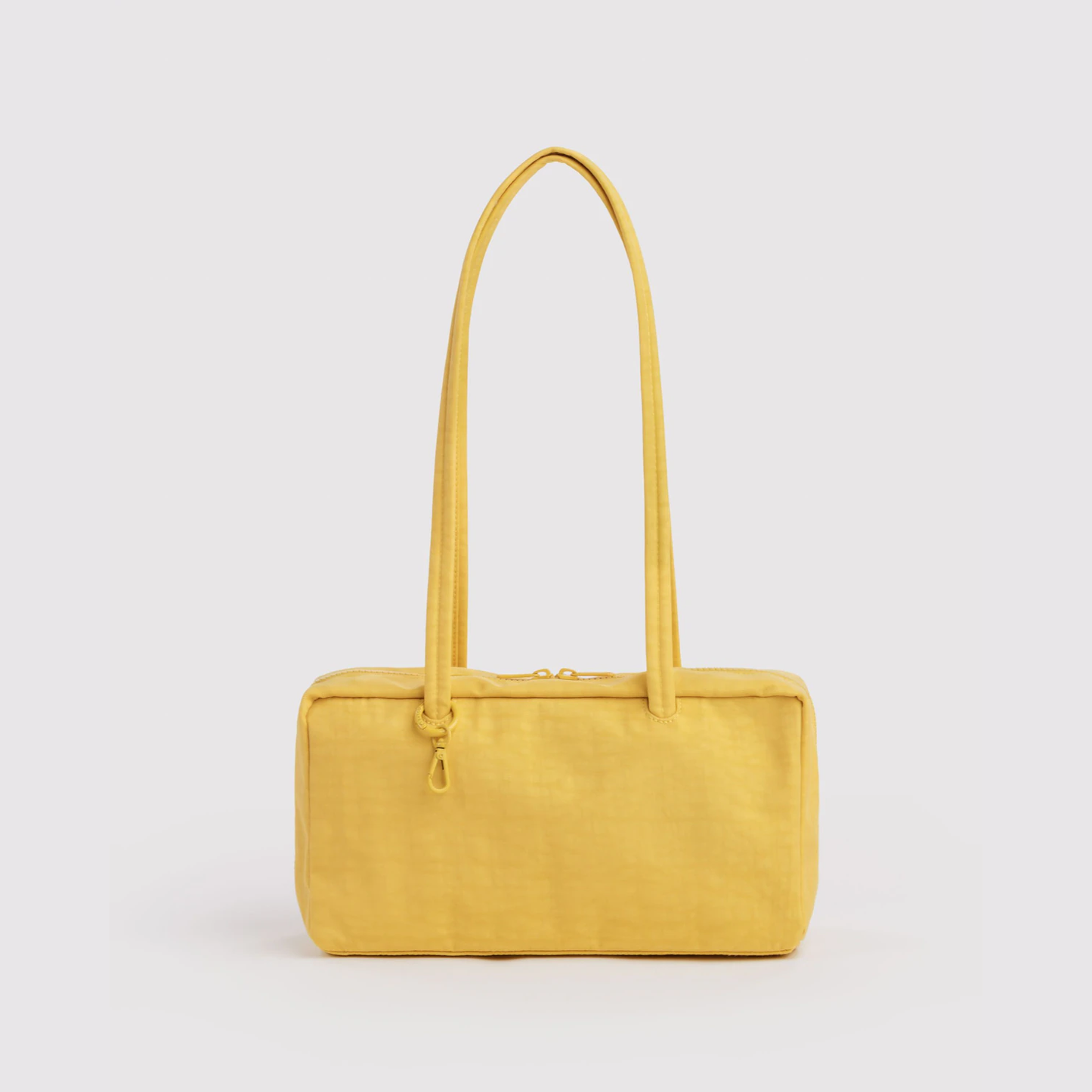 Nylon bowler bag in butter yellow with top handles and zip closure