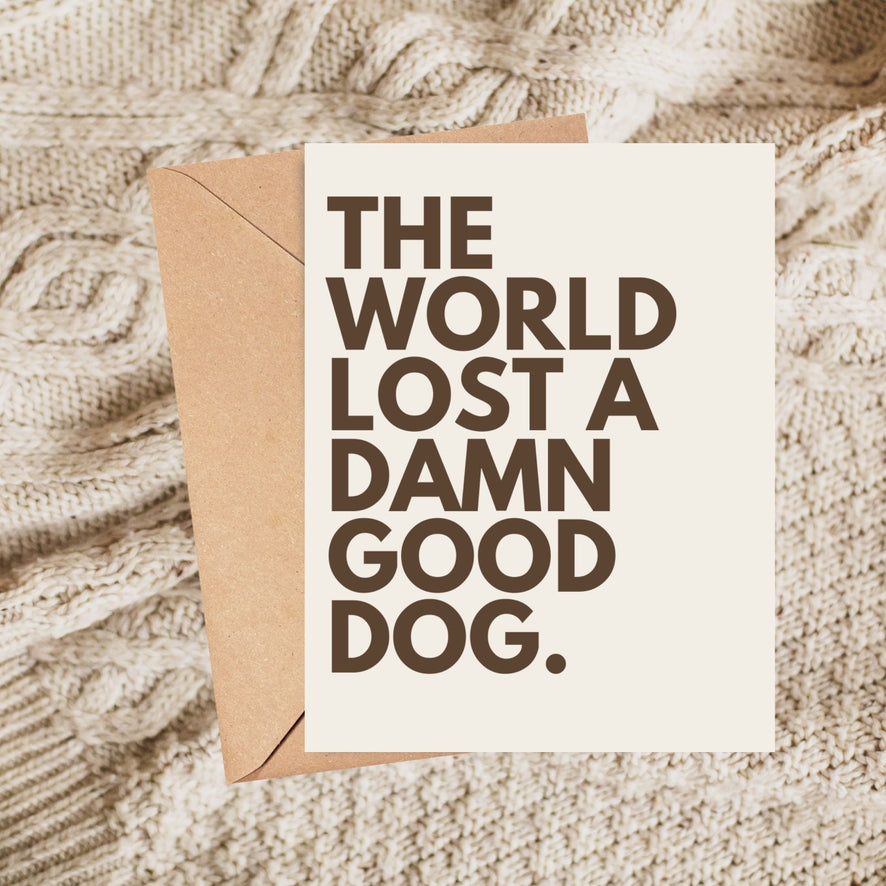 Pet sympathy card with bold message: THE WORLD LOST A DAMN GOOD DOG.