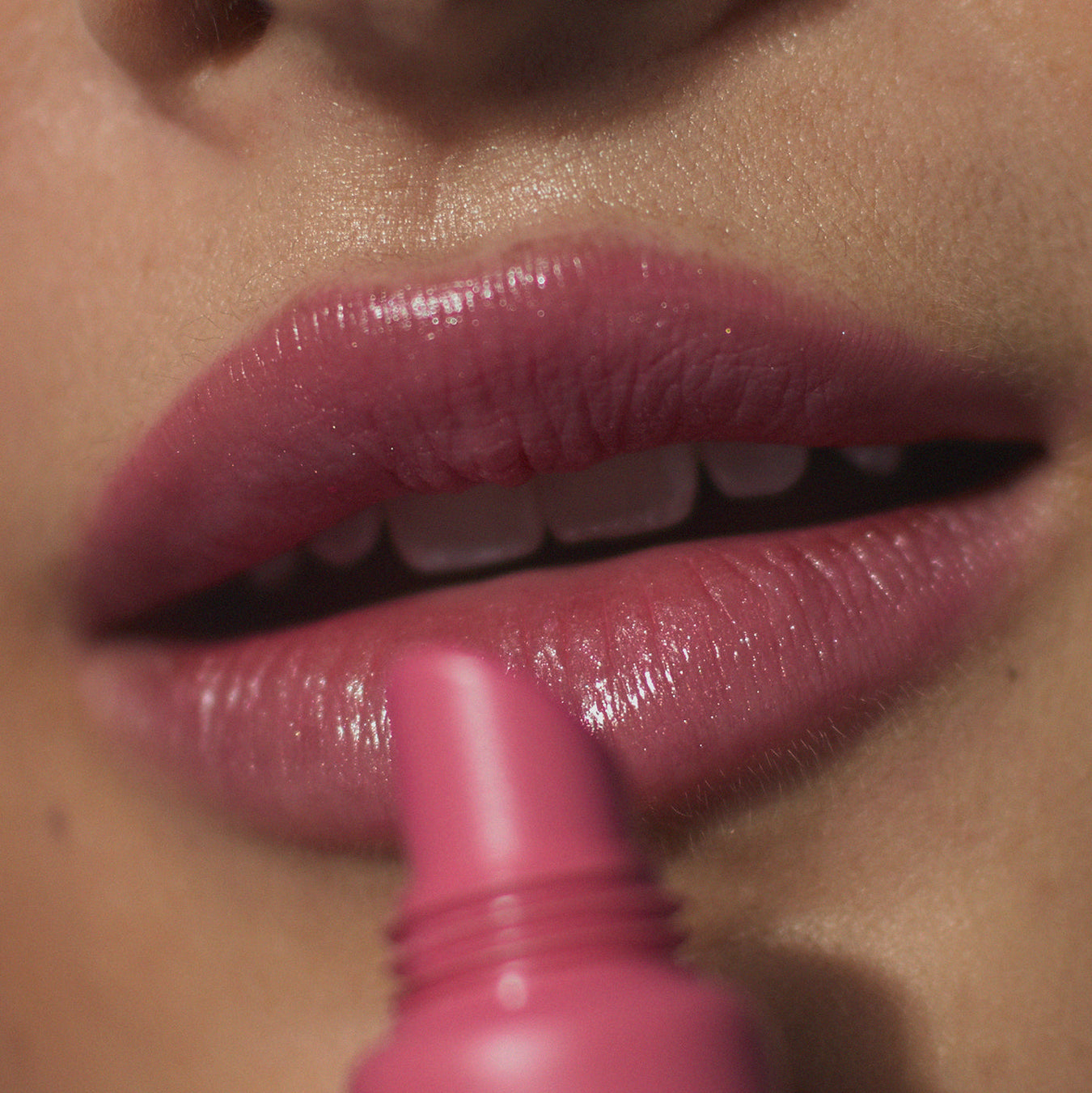 Tint Me Lip Punch lip balm, pink lips with applicator tip close-up