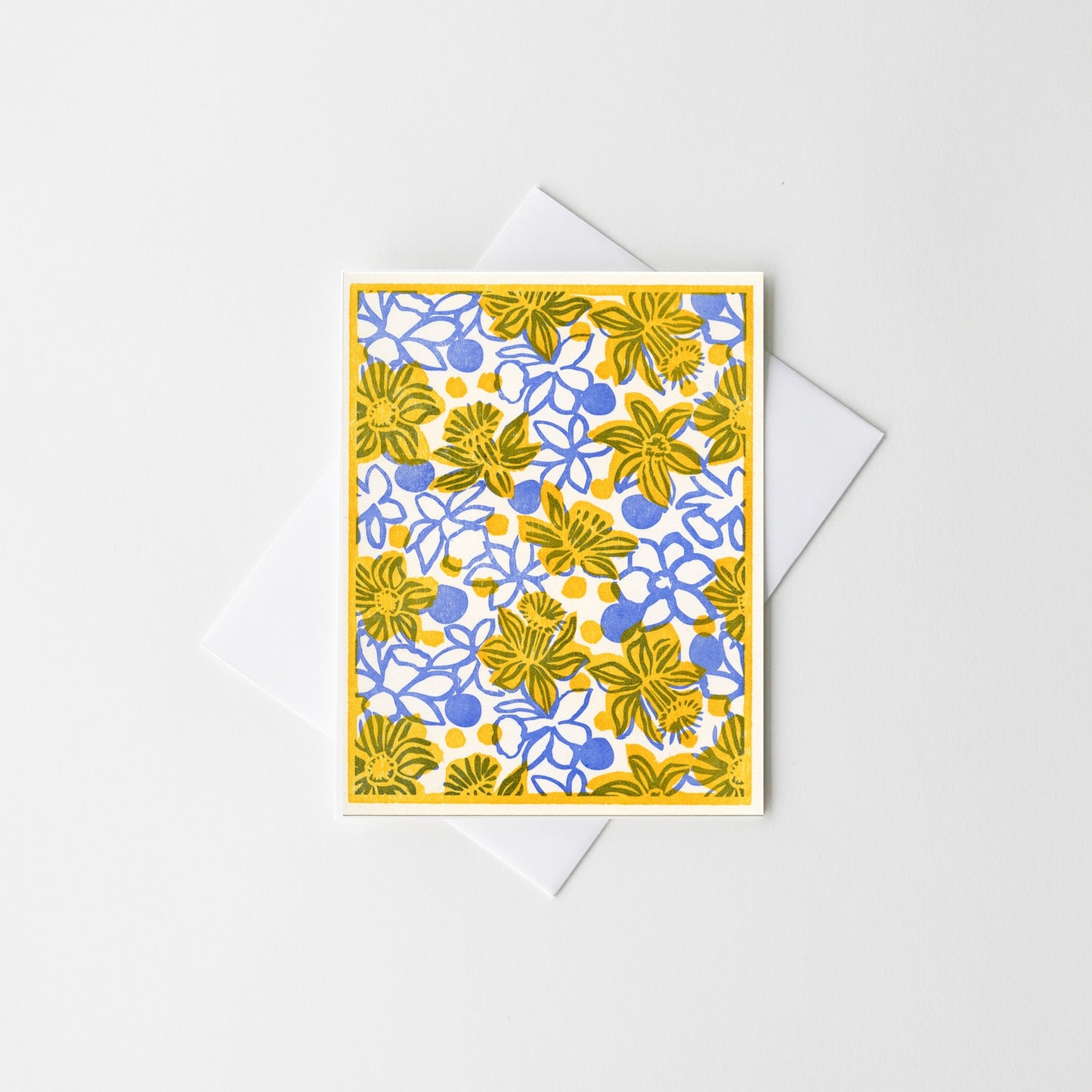 Floral letterpress greeting card with yellow and blue daisy-like flowers
