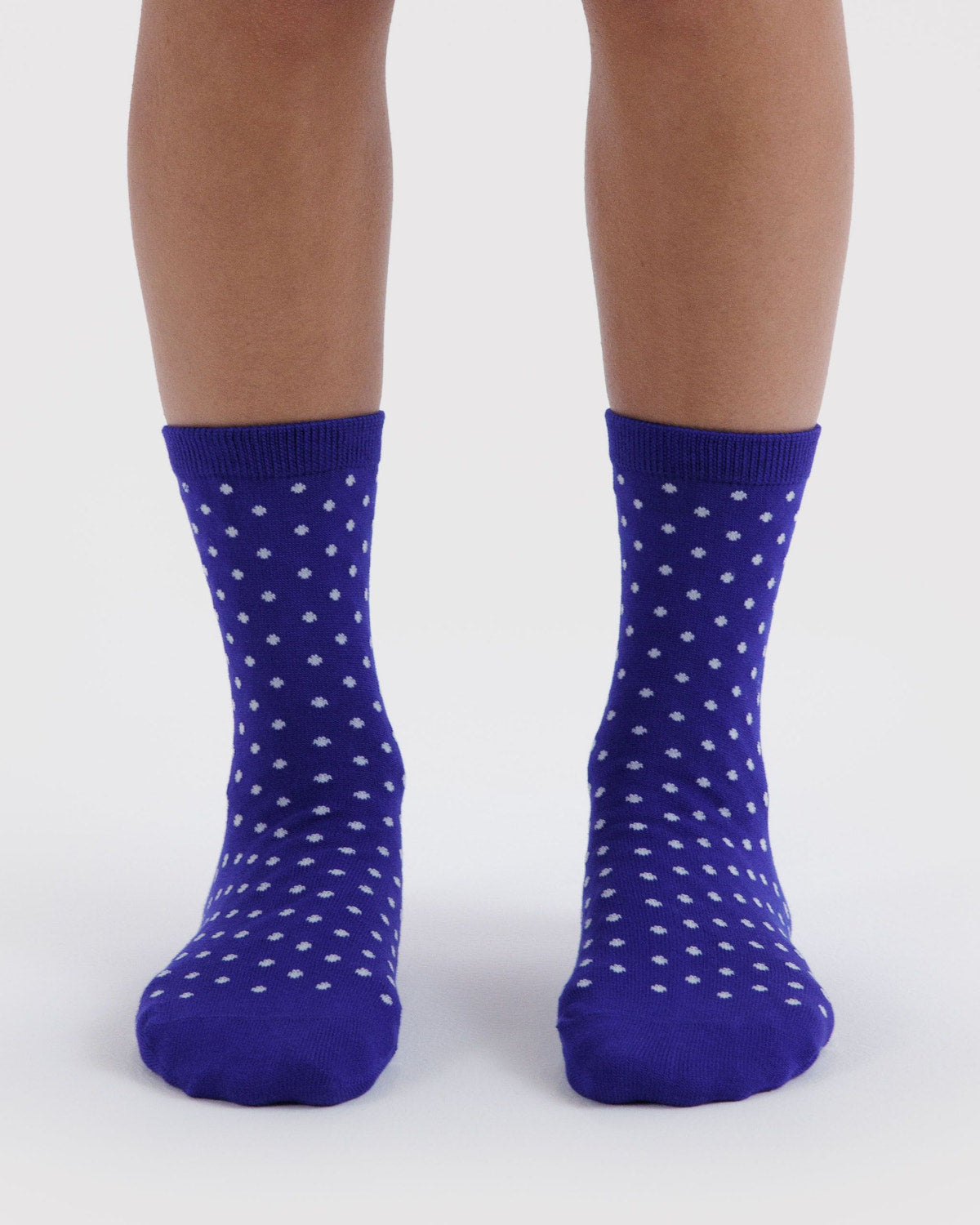 Crew-length socks in royal blue with small white dotted pattern, pair view.
