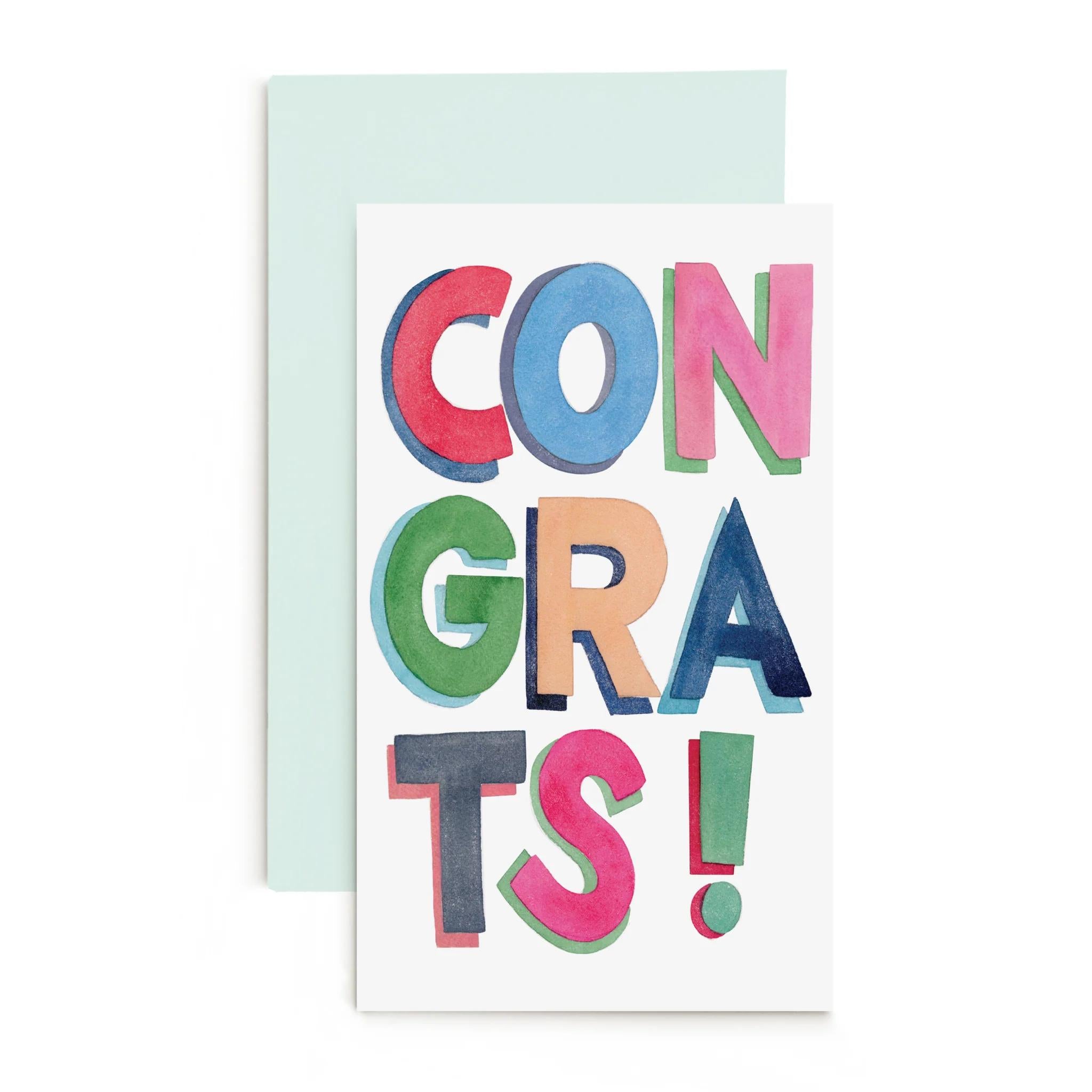 Congrats enclosure card with colorful CONGRATS! lettering, light blue envelope behind
