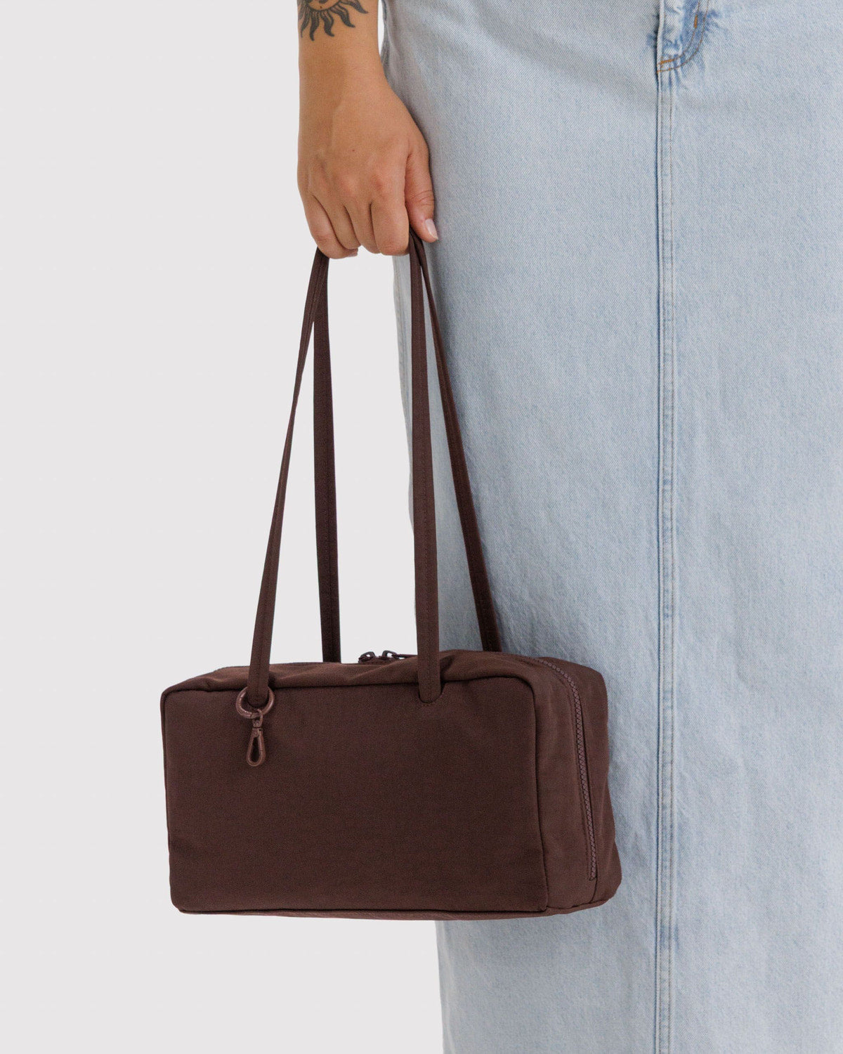 Brown nylon bowler bag with top handles and zippered front pocket