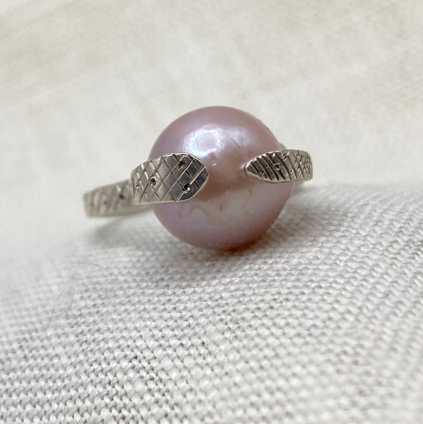 Sterling silver snake ring with blush pearl centerpiece
