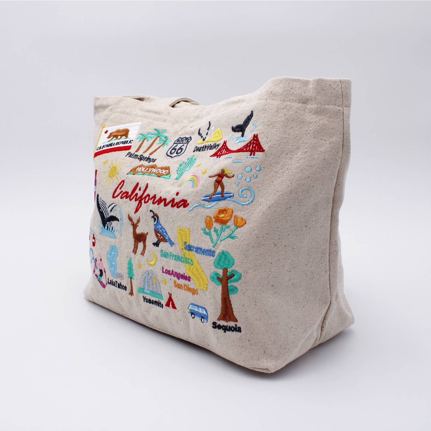 Embroidered California lunch bag, beige canvas with side view of colorful map design