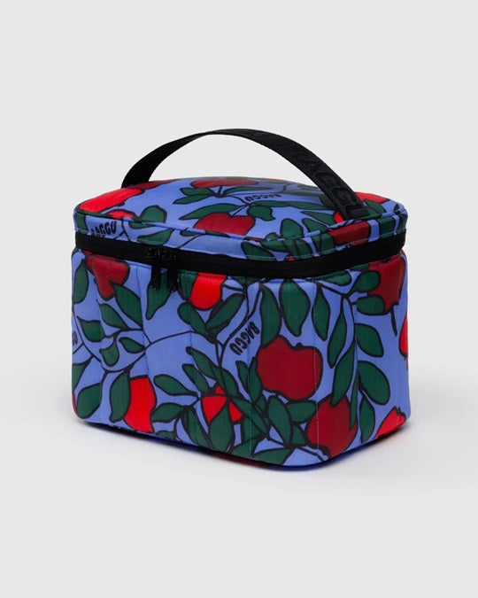 Puffy lunch bag with colorful fruit-and-leaf print on blue, black handle and zipper