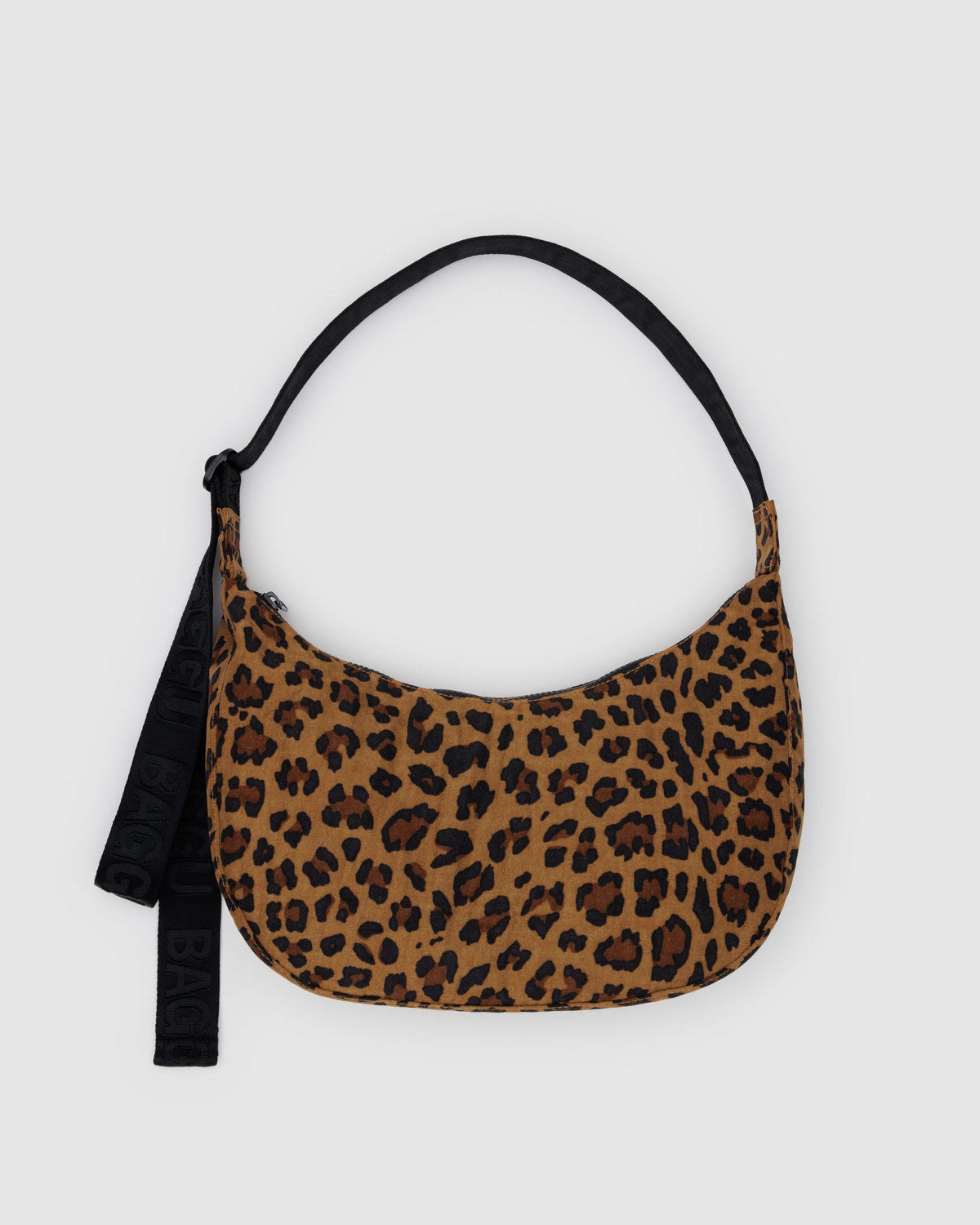 Leopard print nylon crescent bag with black strap and hanging tag