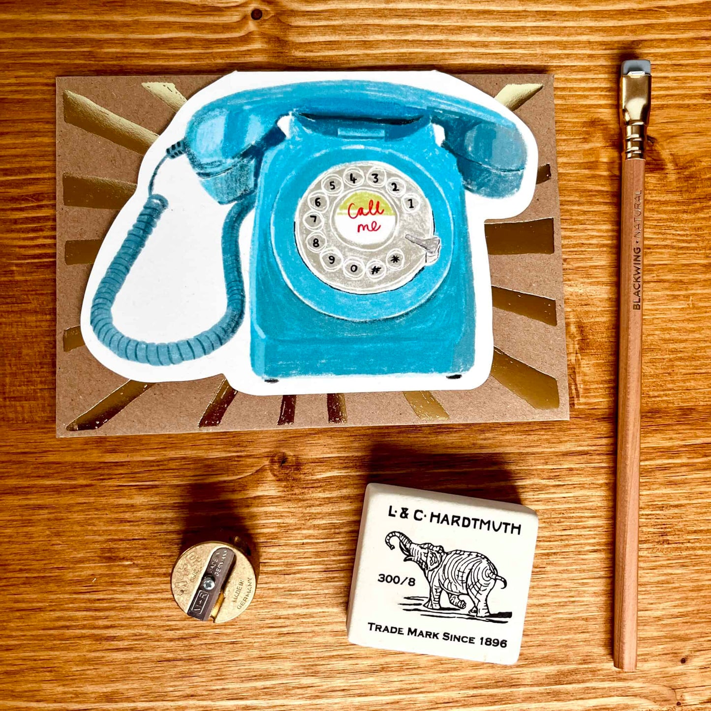Telephone card with blue vintage rotary phone illustration and "Call me" text