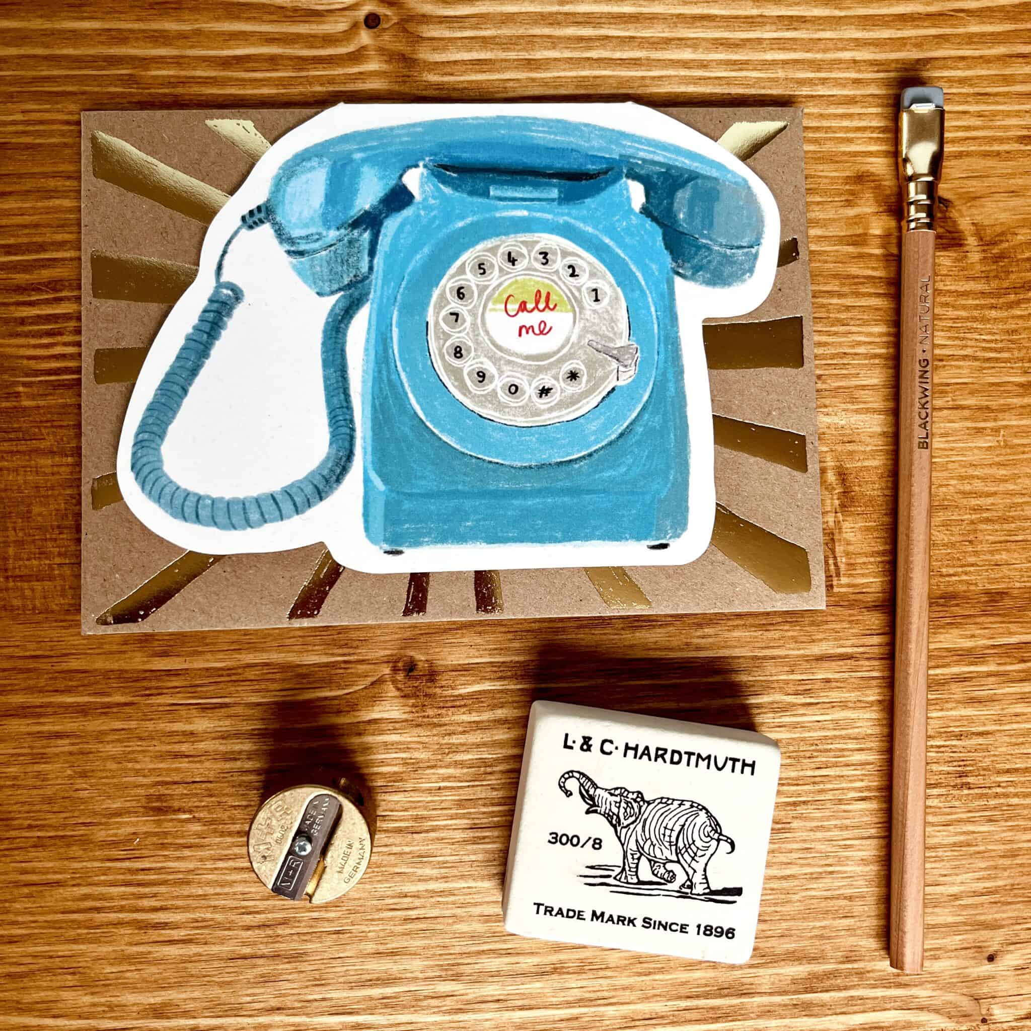 Telephone card with blue vintage rotary phone illustration and "Call me" text