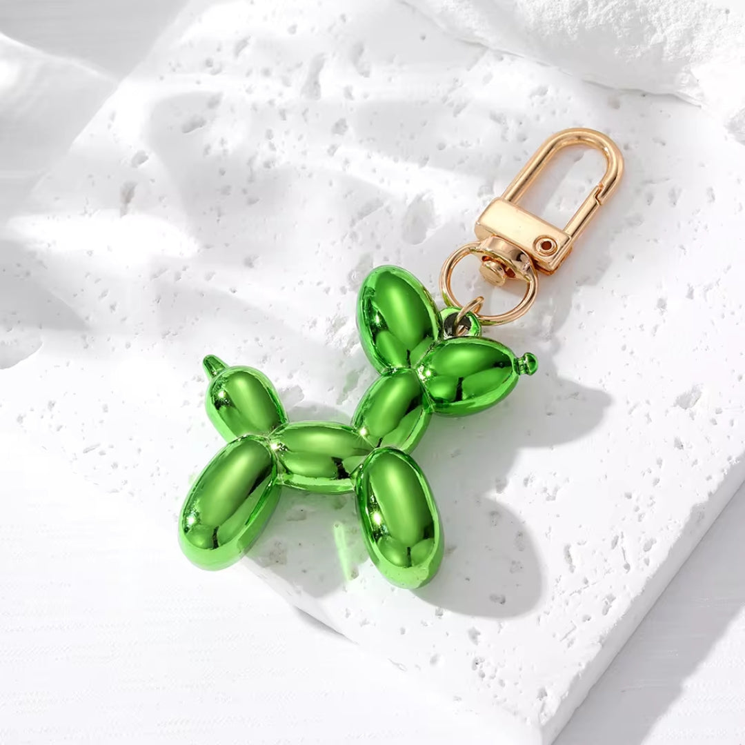 Green metallic balloon dog keychain with gold clasp and split-ring attachment