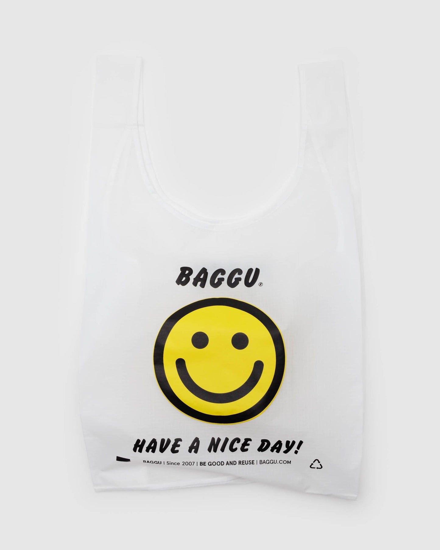 Reusable tote bag in white with centered smiley graphic and “HAVE A NICE DAY” text.