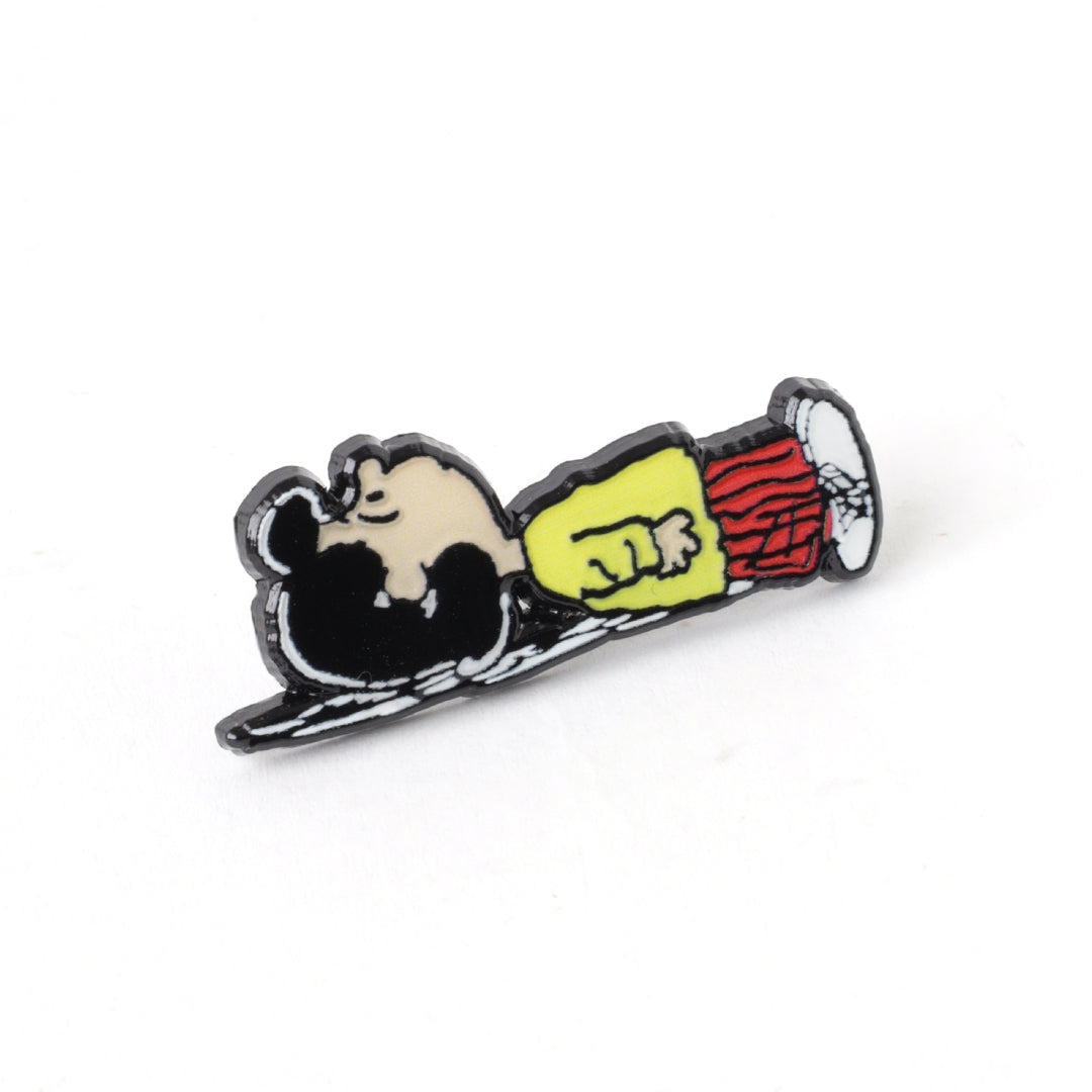 Valentine enamel pin of a cartoon character holding a yellow heart on a shoe