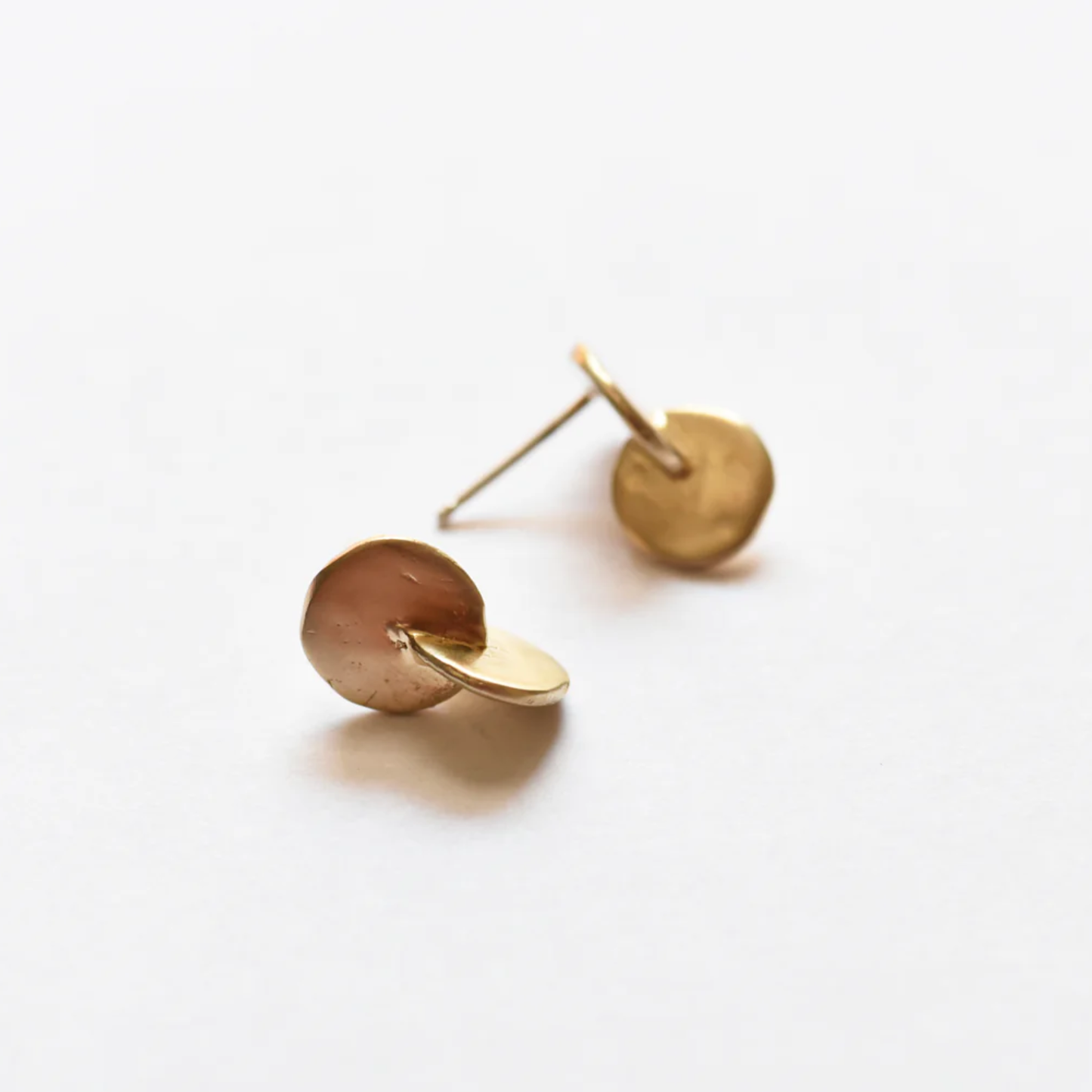 Brass interlocking disc stud earrings, round hammered finish on gold-tone studs