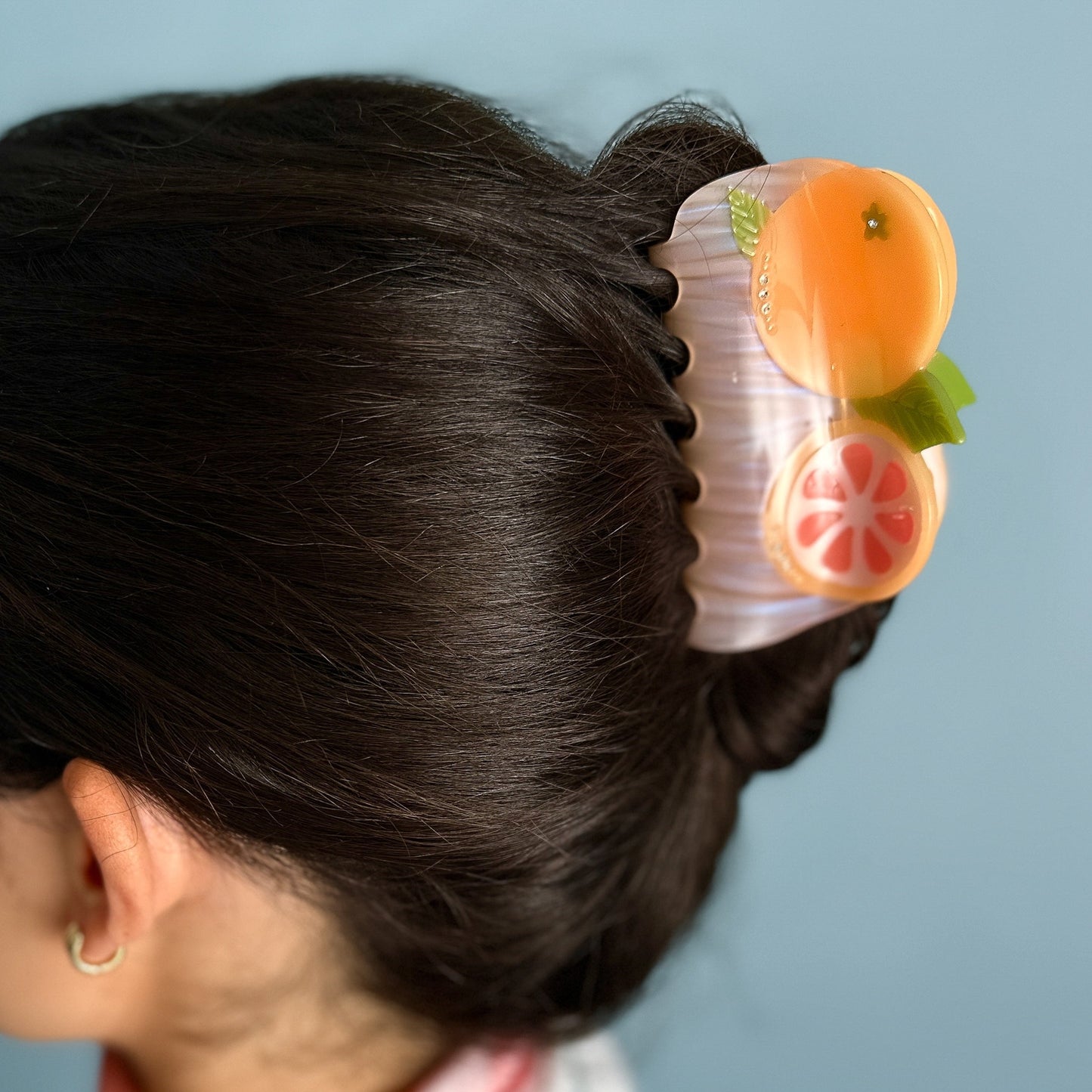 California pomelo fruit hair claw with orange fruit slices and clear pink base clip