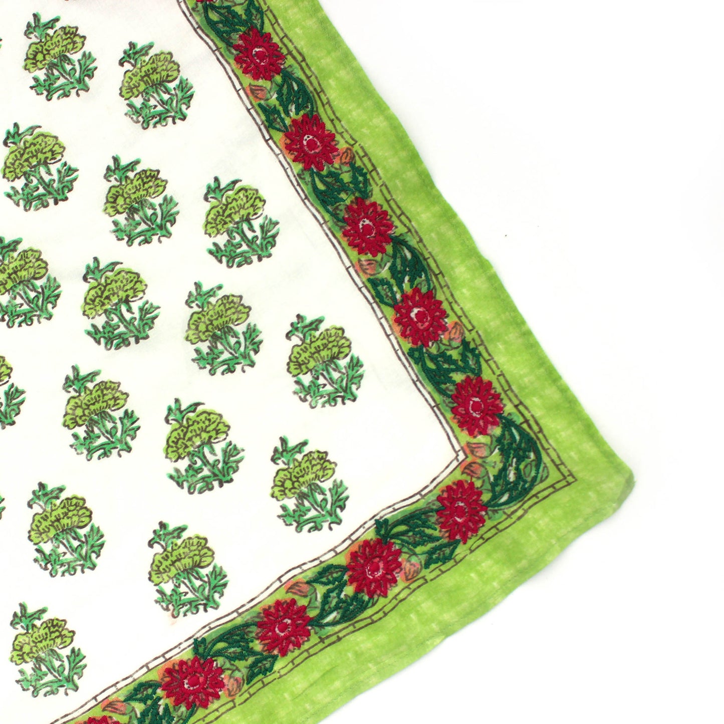 Buti bandana corner detail: green fabric, red floral trim, embroidered tree motifs