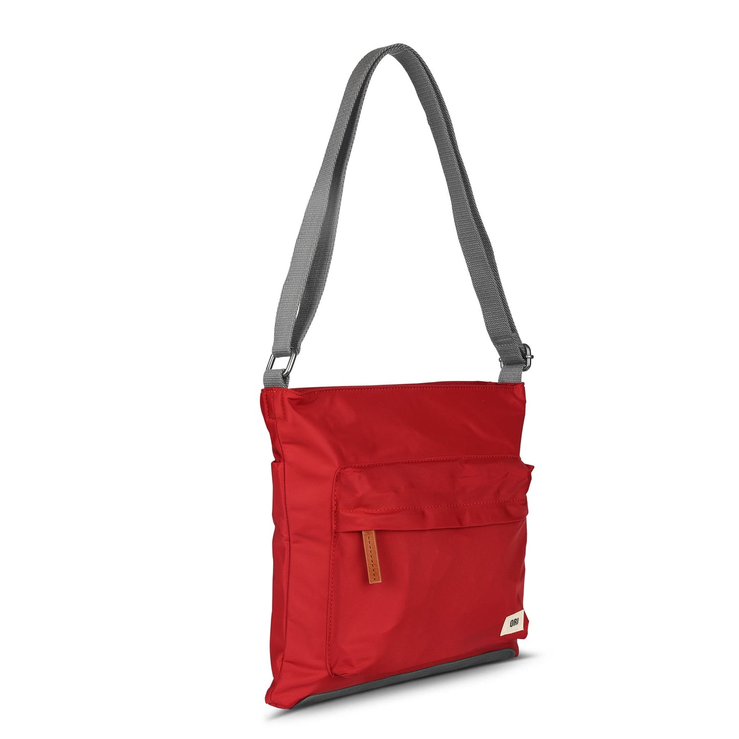 Red nylon crossbody bag with top zipper, front flap pocket, and adjustable gray shoulder strap