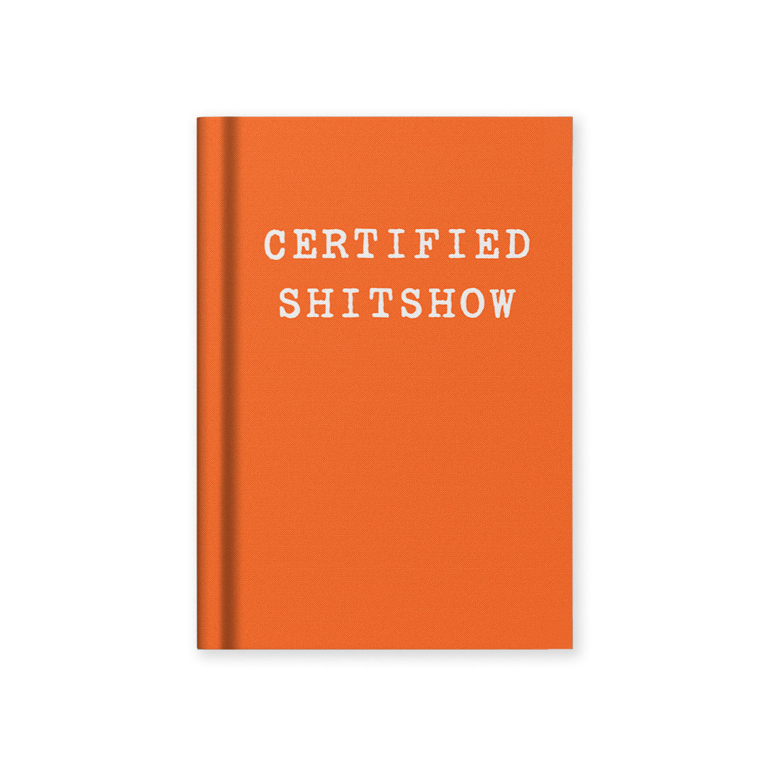 Orange hardback notebook with CERTIFIED SHITSHOW cover text